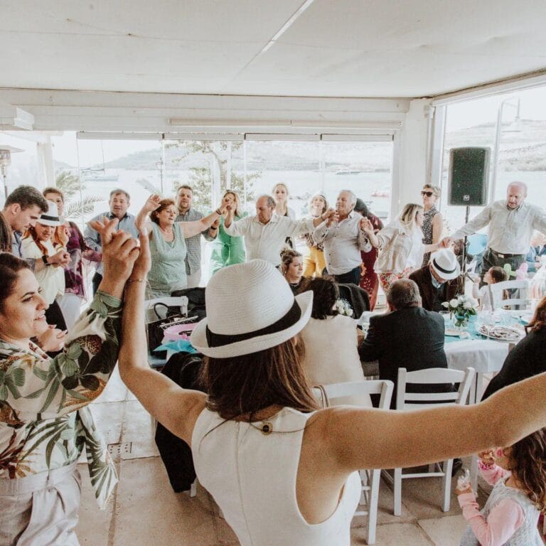 Guests dancing and enjoying a lively private event with DJ entertainment
